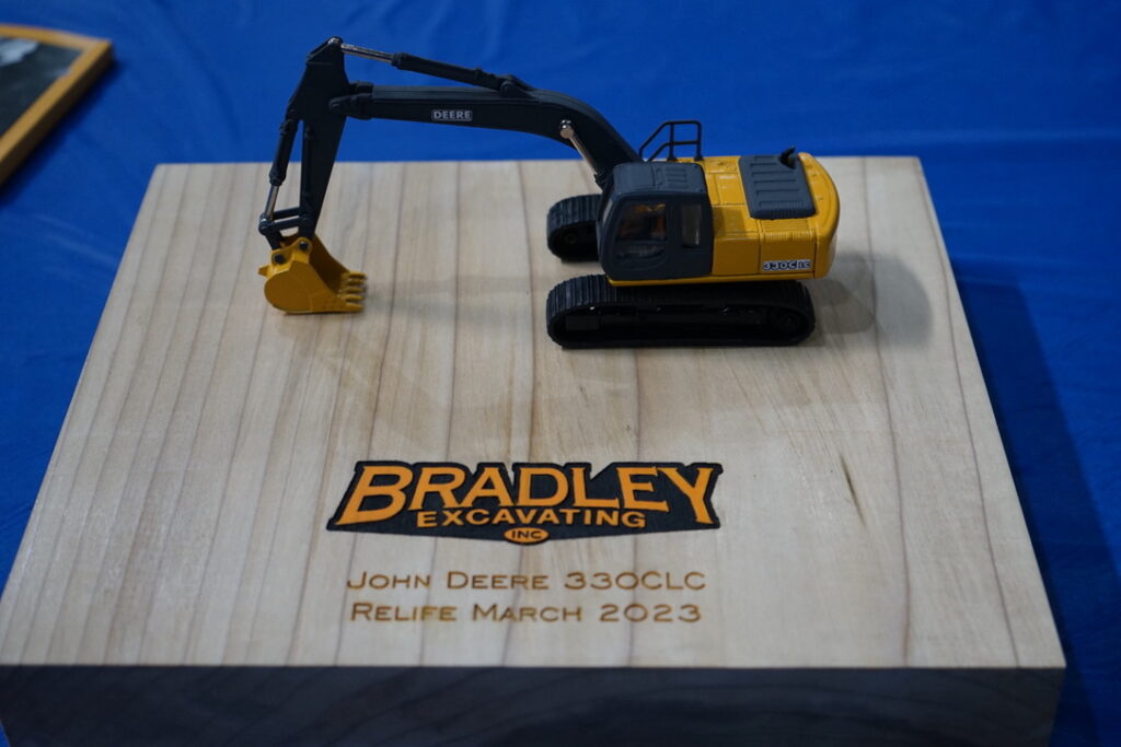 Miniature model of excavator from relife job with Bradley Excavating